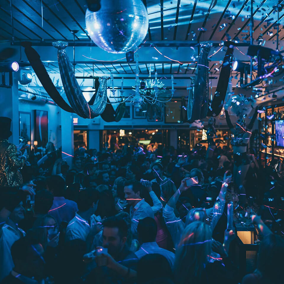 A view of a nightclub with blue lighting