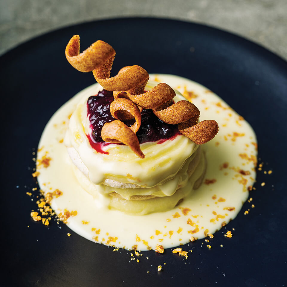 A black dish with a dessert