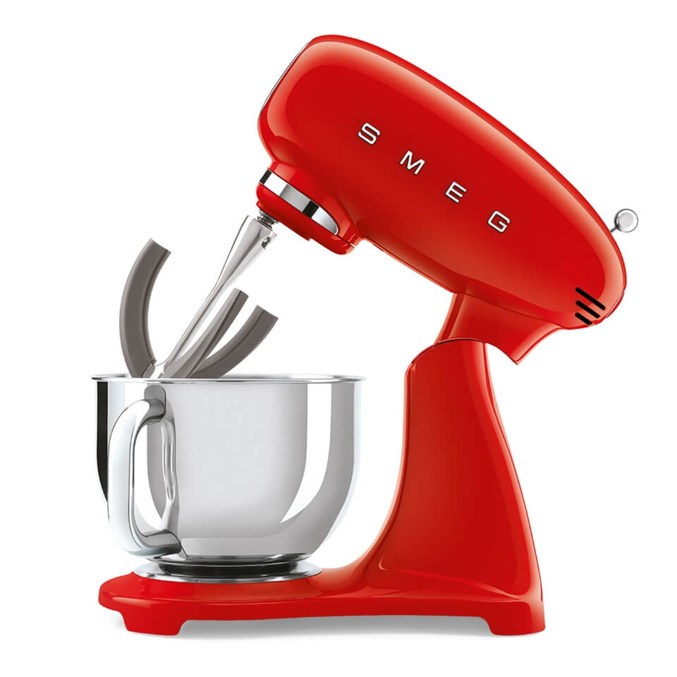A red Smeg stand mixer with a stainless steel bowl and the head tilted up
