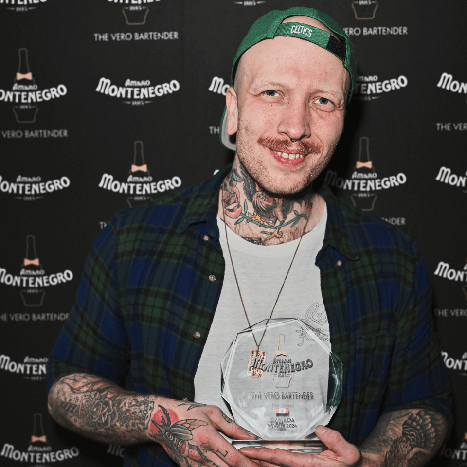 Man holding crystal trophy