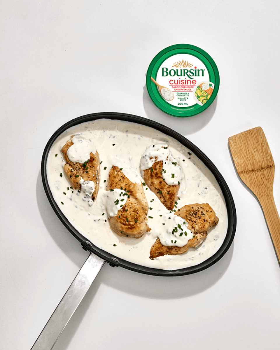 overhead image of fry pan with chicken and cream sauce