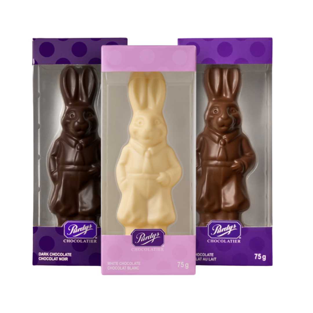 Three chocolate Easter bunnies in individual purple packaging. 