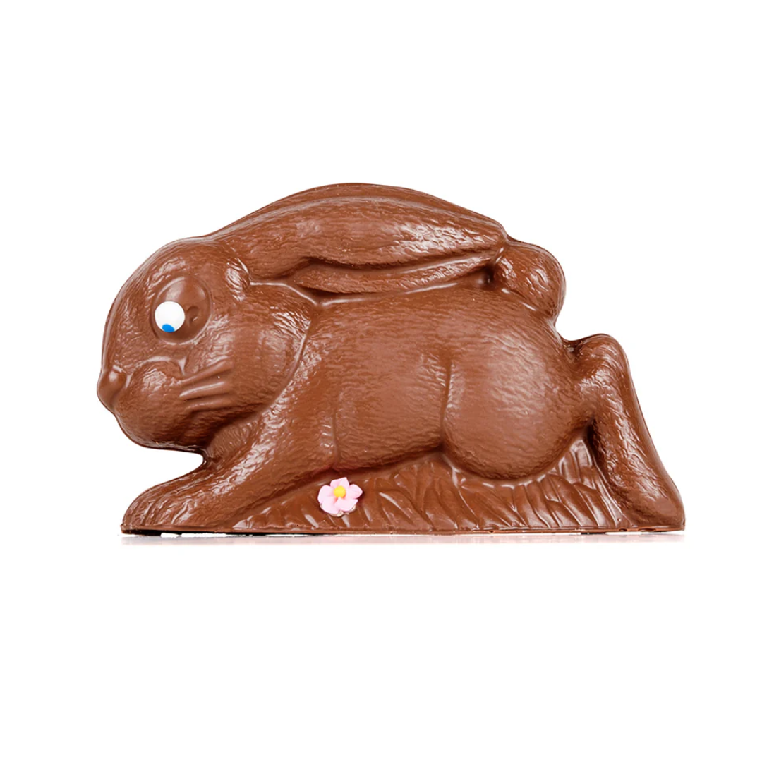 A hollow milk chocolate Easter bunny running.