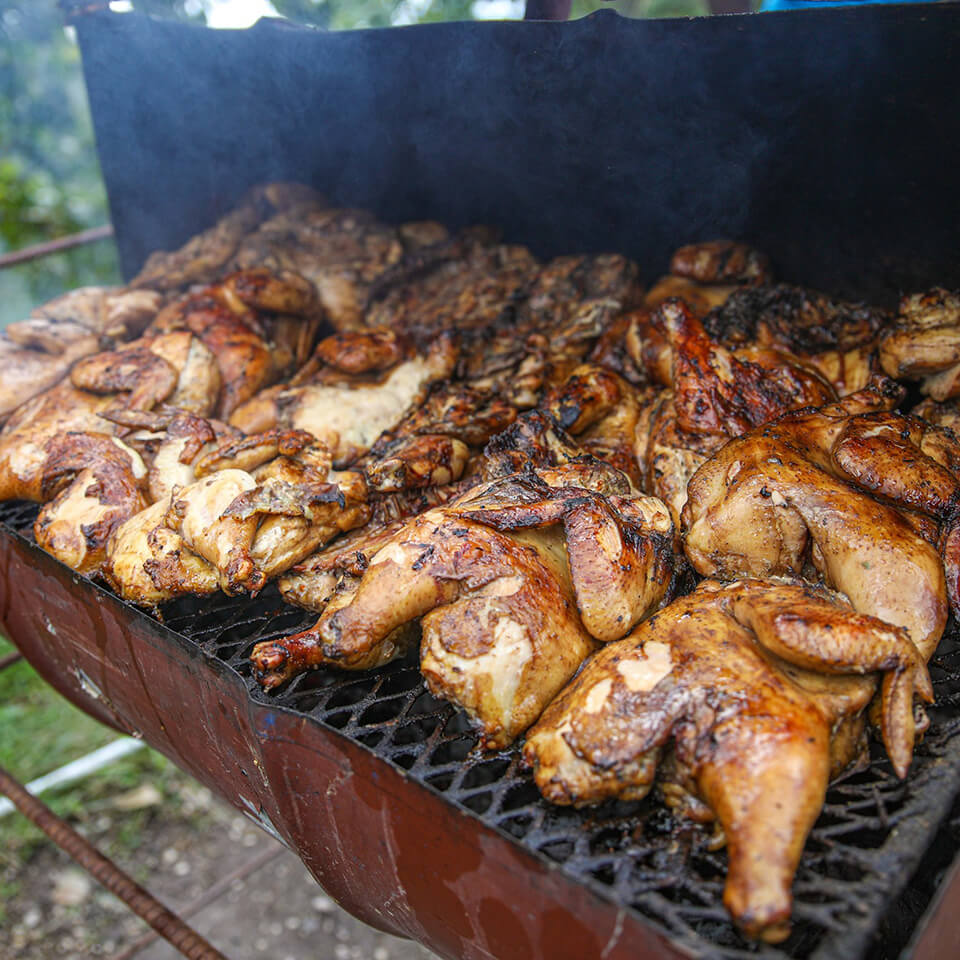 Jerk chicken on an outdoor grill