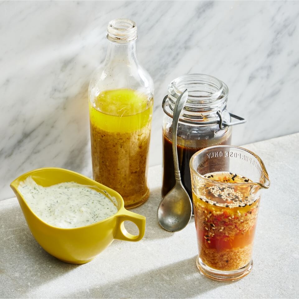 Four containers of salad dressing