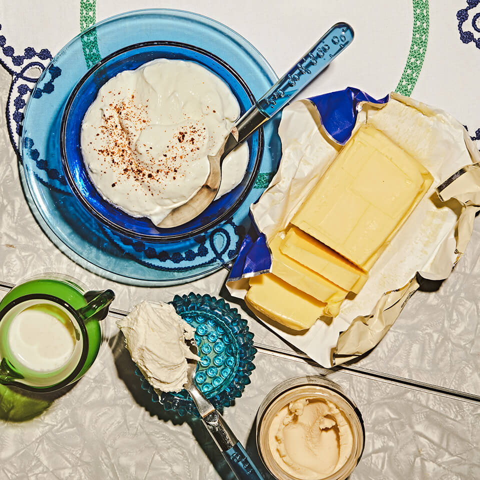 A bluButter and various dishes and spoons of cream