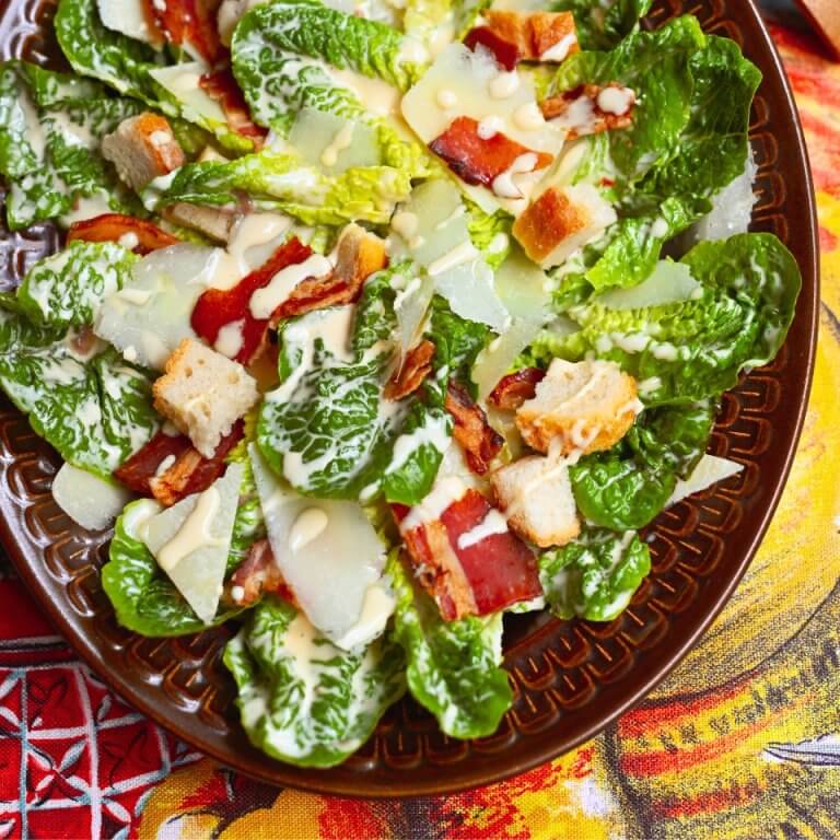 A dish with classic Caesar salad and homemade croutons