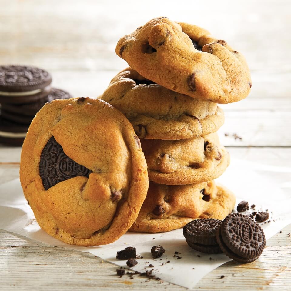 A stack of chocolate chip cookies with Oreos inside