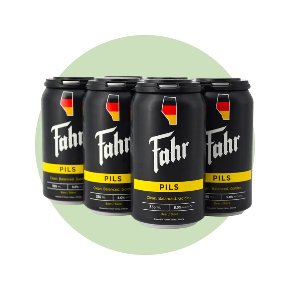 A six pack of black beer cans over a cream-coloured circle