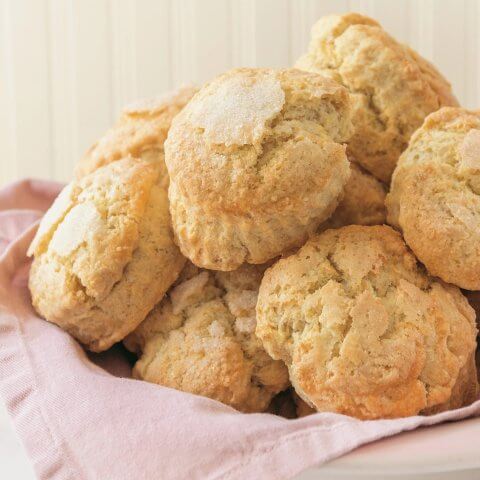 A pile of homemade scones on a pink napkin.