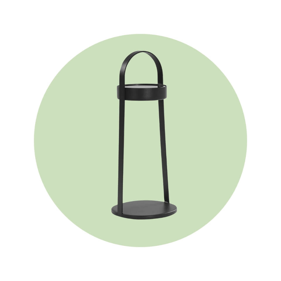 A black lamp inside a light green circle