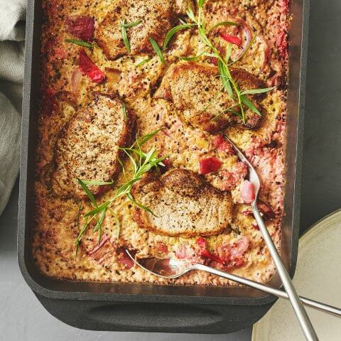 A tray with pork cutlets and quinoa
