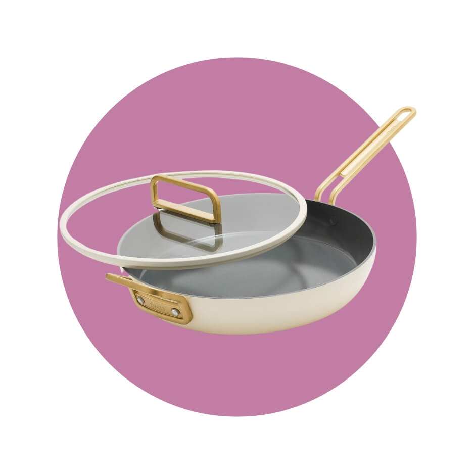 A white pan with a lid over a purple circle