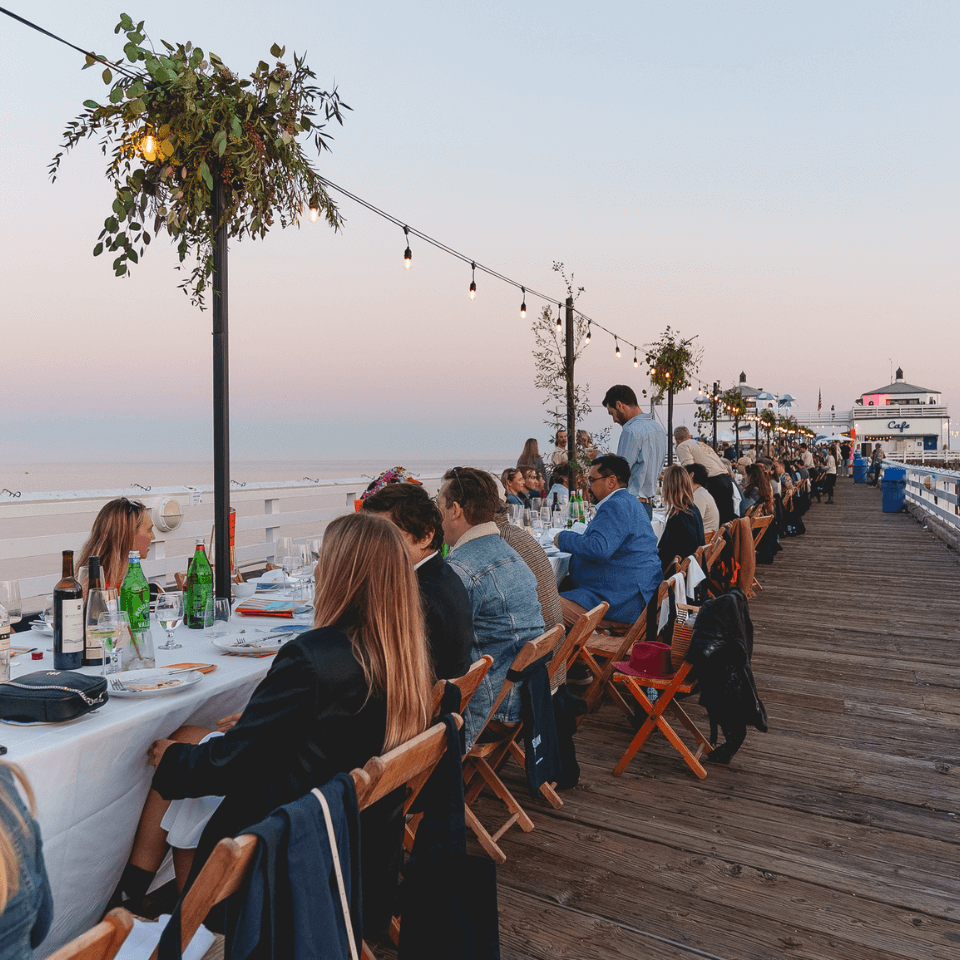 people sitting at long row of table