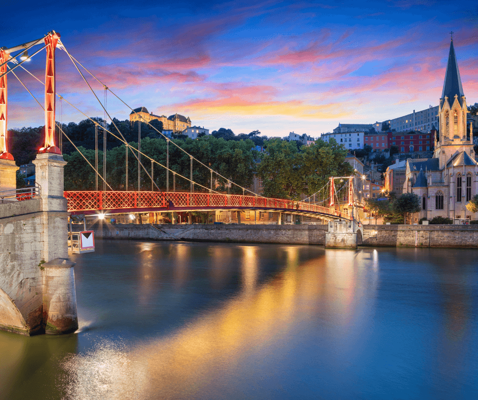 bridge over river at sunset