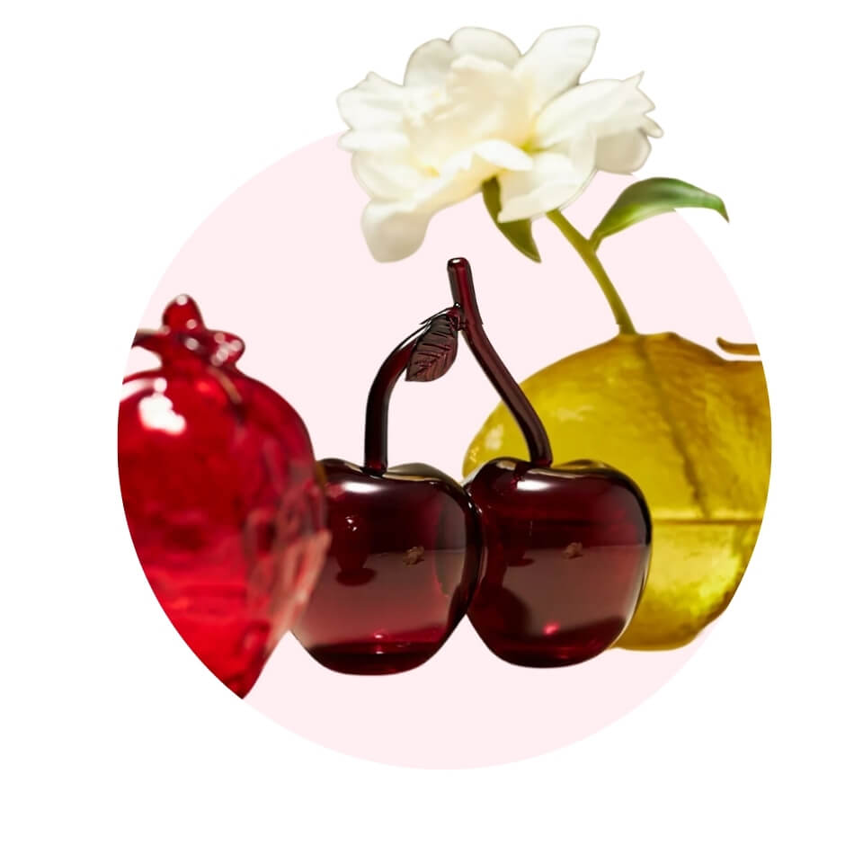 Three fruit-shaped vases in a light pink circle