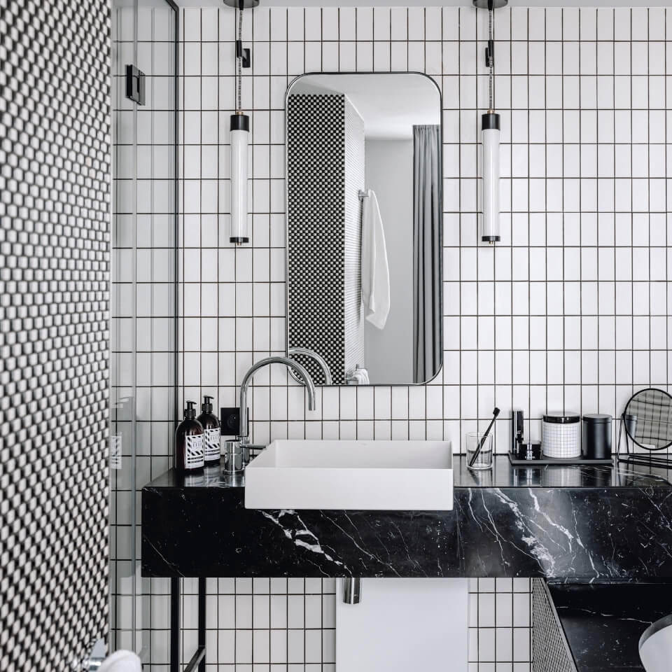 A bathroom done in black and white
