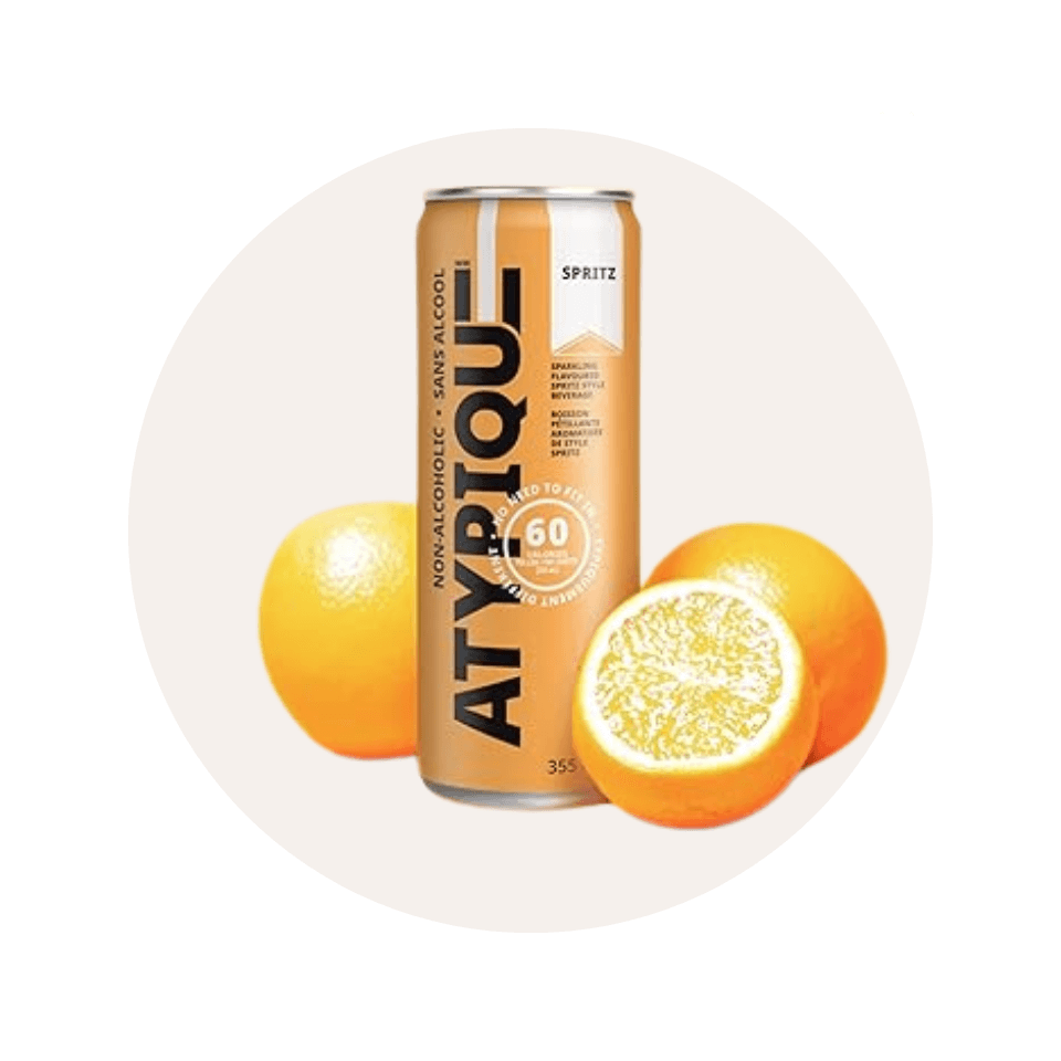 An orange tall can with sliced oranges around it
