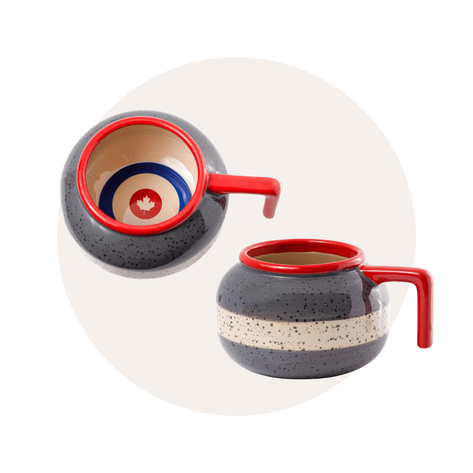 Two coffee mugs shaped like curling stones over a cream-coloured circle