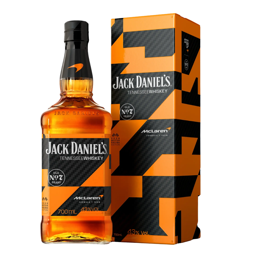 Orange bottle of whisky next to an orange and black collector's box. 