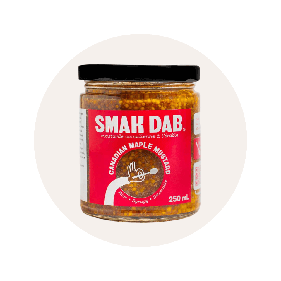 A canister of mustard in a cream-coloured circle