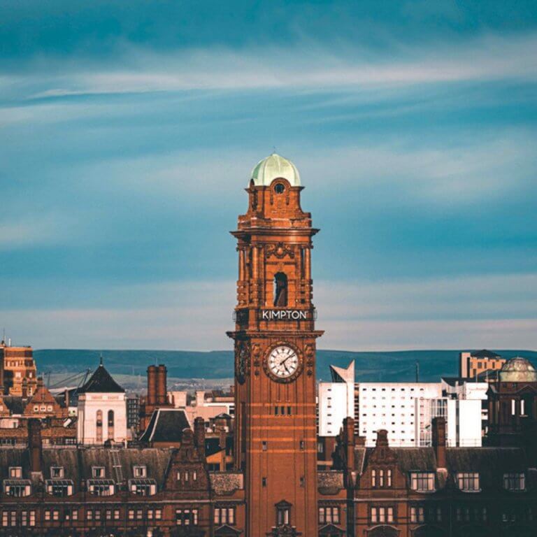 A clocktower against a blue sky