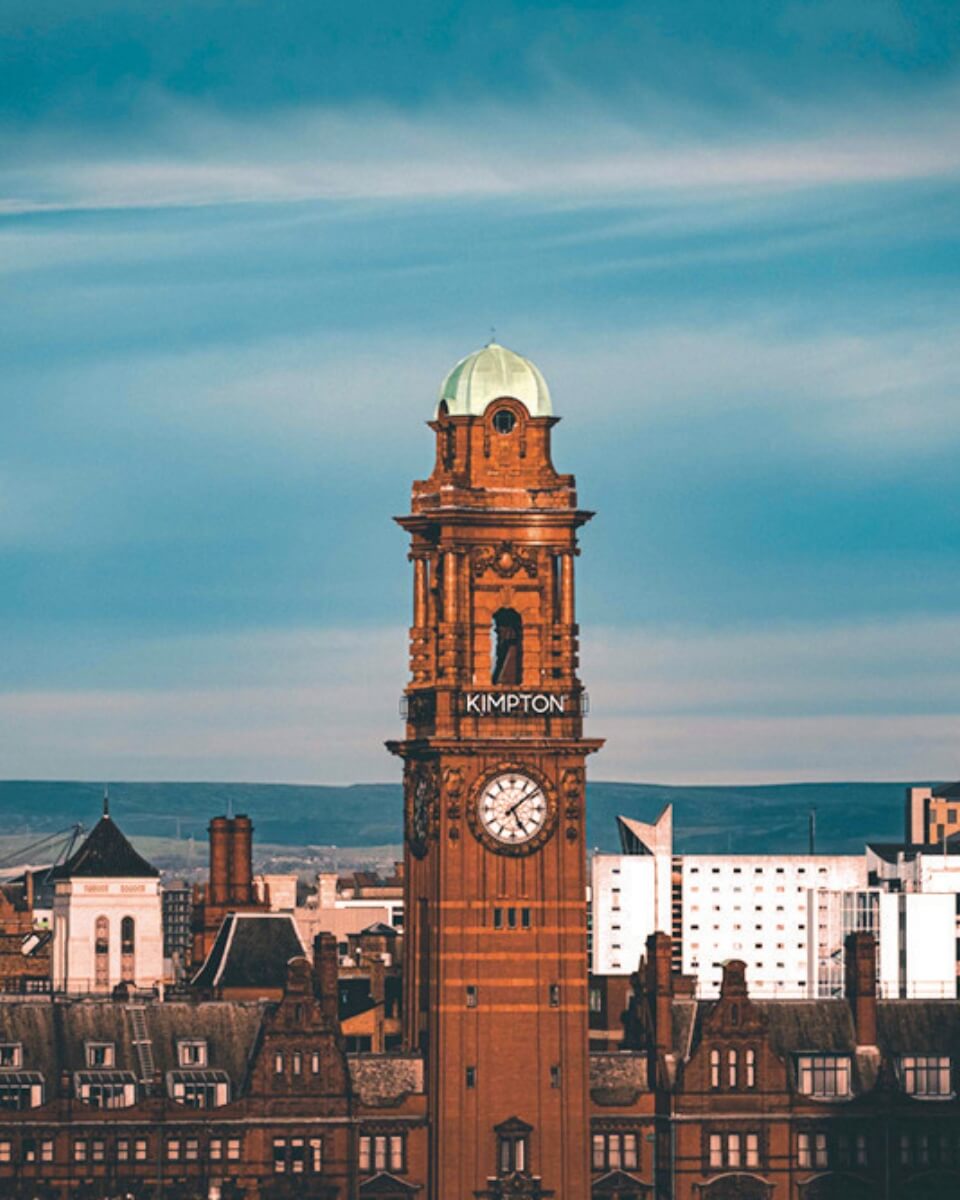 A clocktower against a blue sky