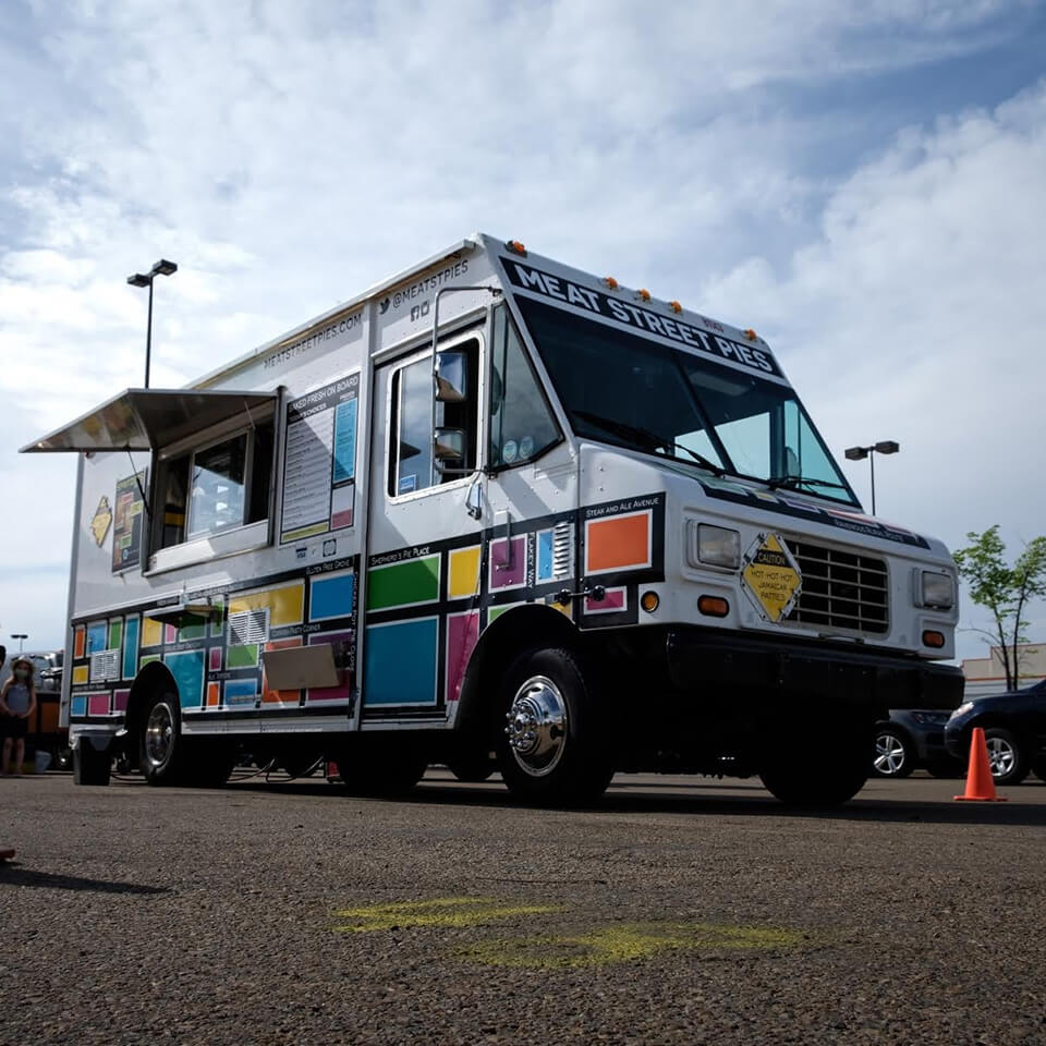 A food truck in a parking lot