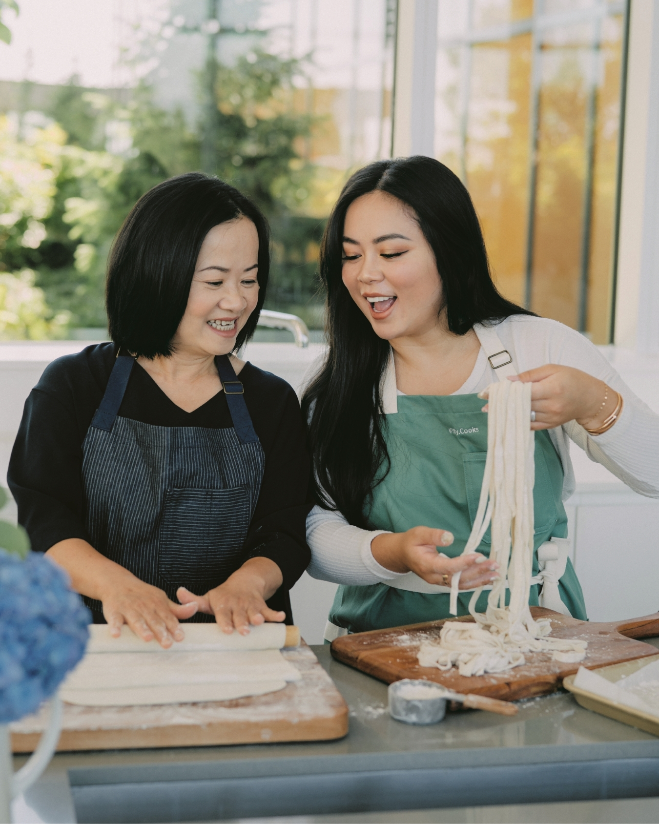 Tiffy Chen makes fresh noodles with her mother in a home kitchen.