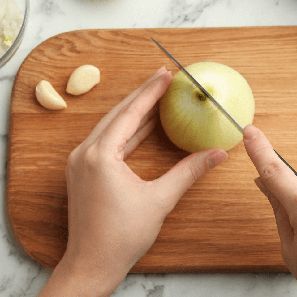 cutting onions on breadboard