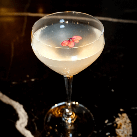 cocktail sitting on black marble