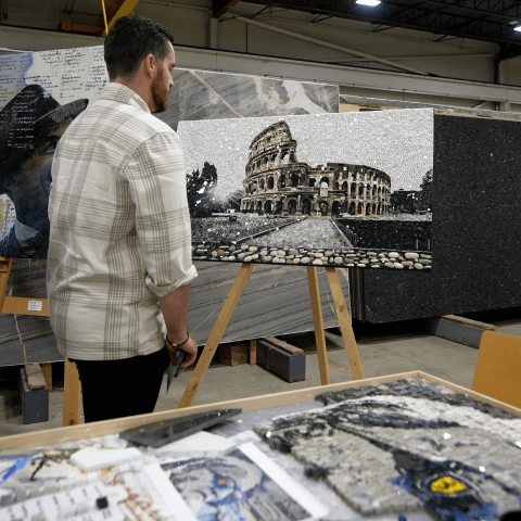 A man looking at a a mosaic