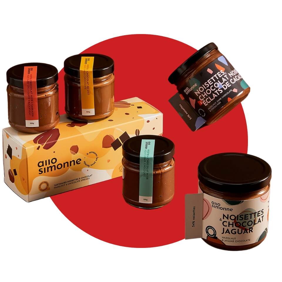 A box and jars of chocolate-hazelnut spread over a red circle