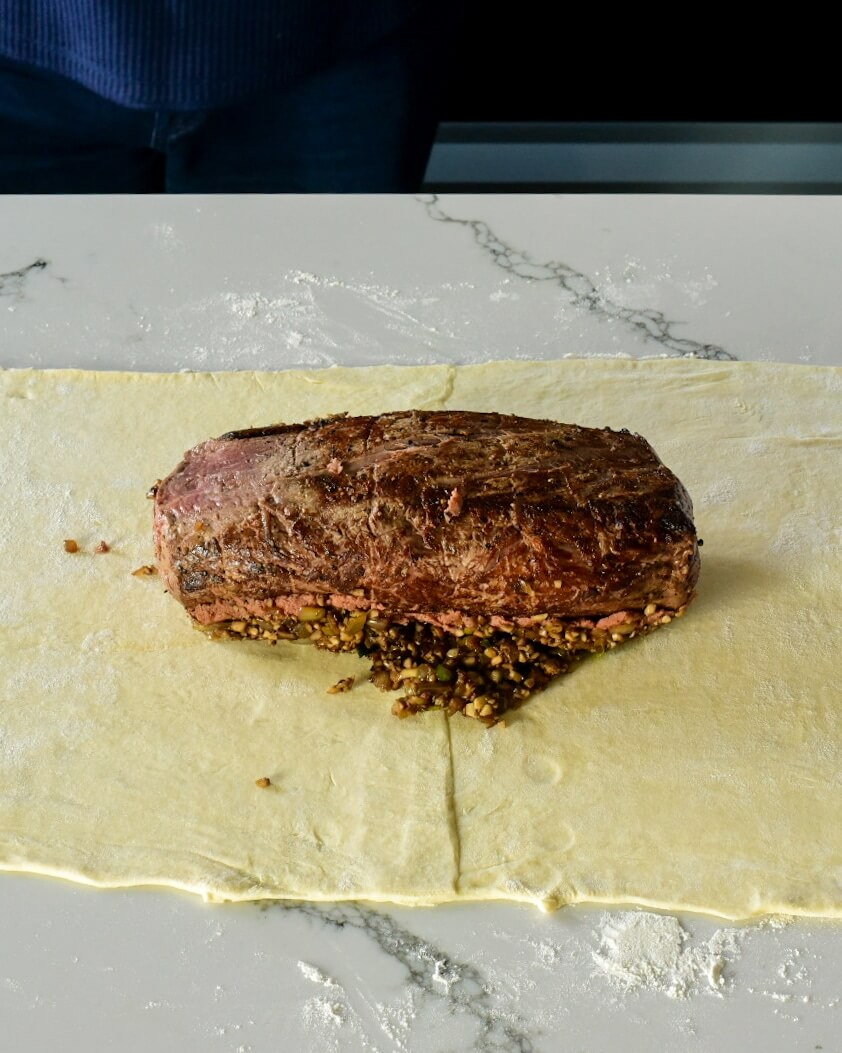 cooked beef on puff pastry