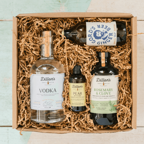 four bottles of alcohol in box