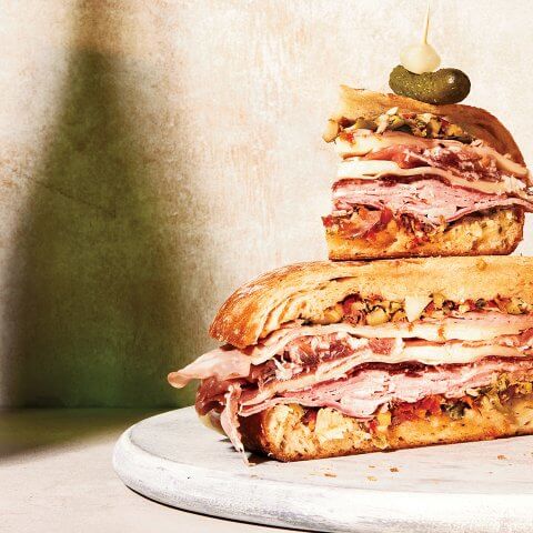 A muffeletta sandwich with layers of meat