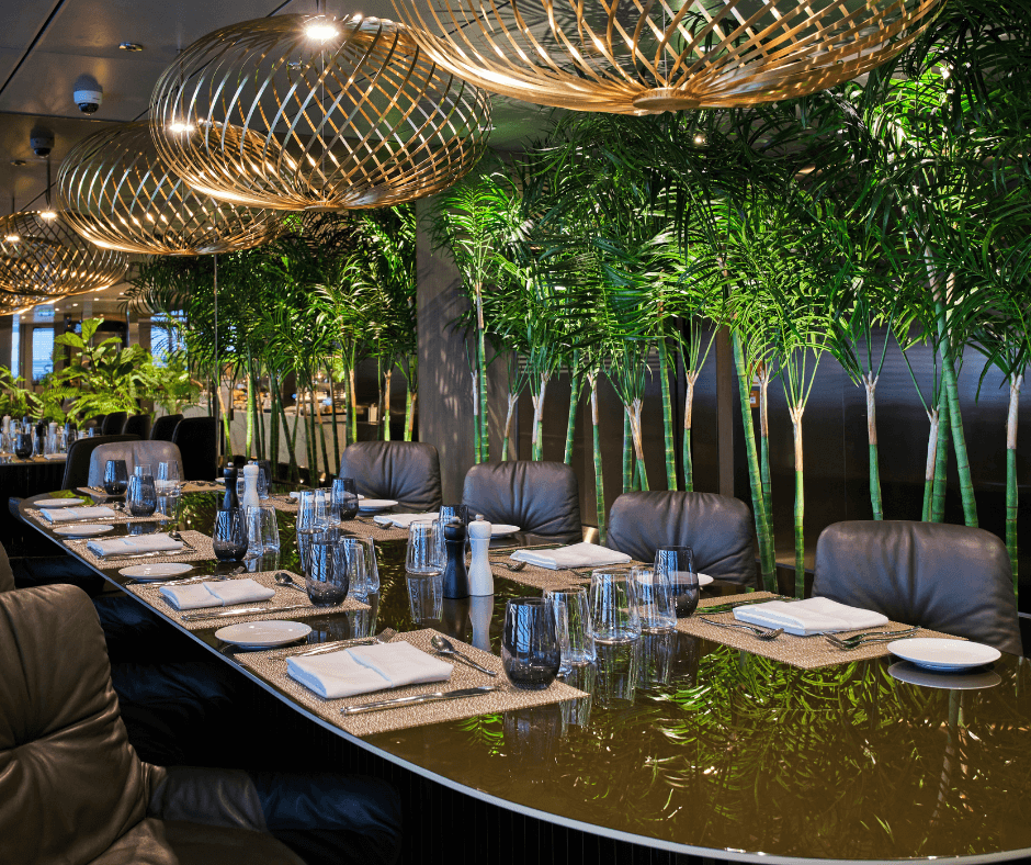 A long elegant table on the Emerald Sakara La Cucina restaurant
