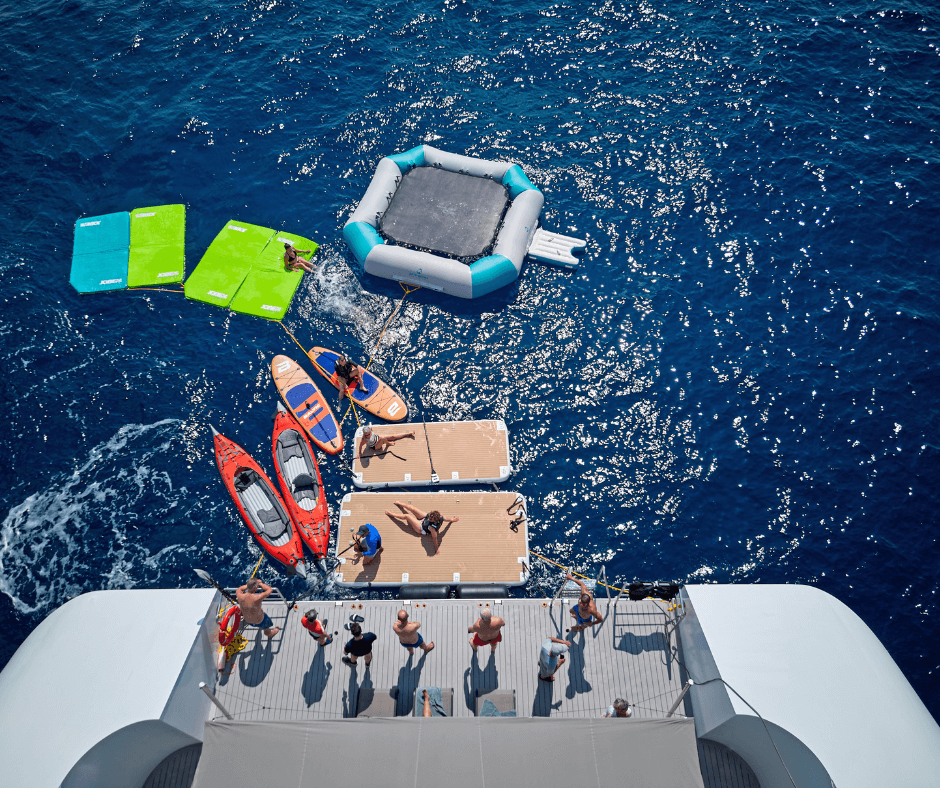 Enjoying the marina platform on the Emerald Sakara with sea kayaks and a water trampoline