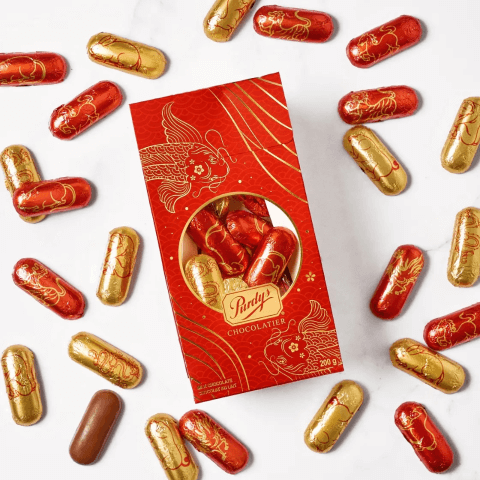 box of canadian chocolates with red and gold