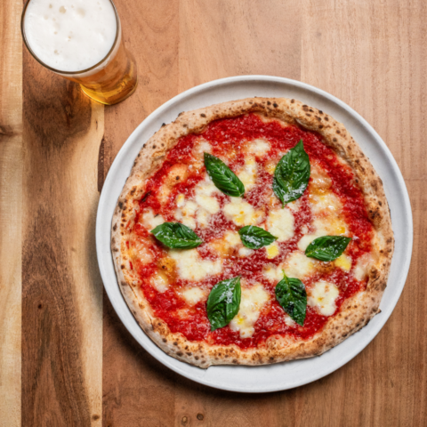 Overhead shot of beautiful margherita pizza made by Canadian company