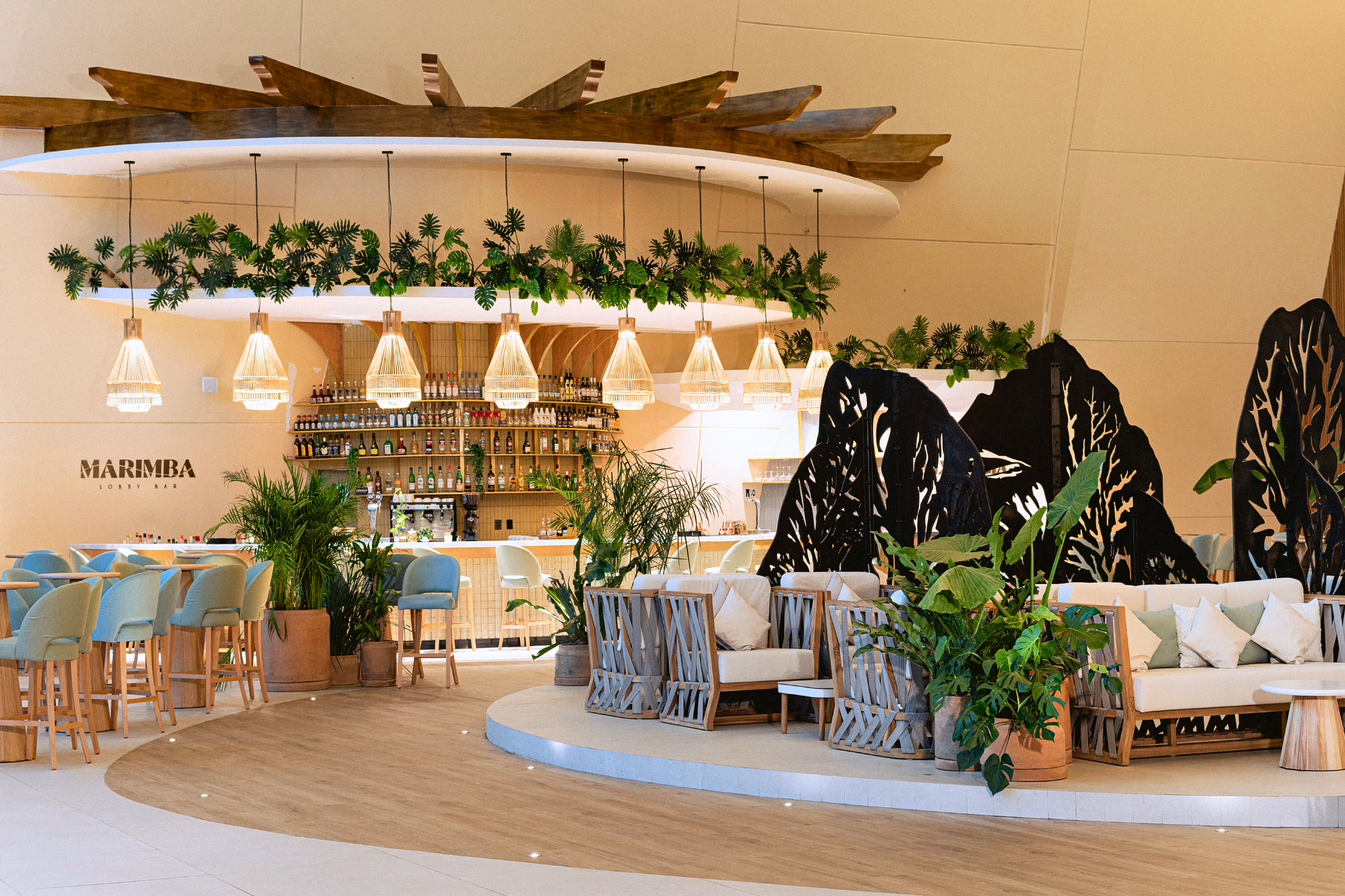 Grand Sirenis Riviera Maya Resort & Spa, Marimba Lobby Bar with black metal art and light wood bar