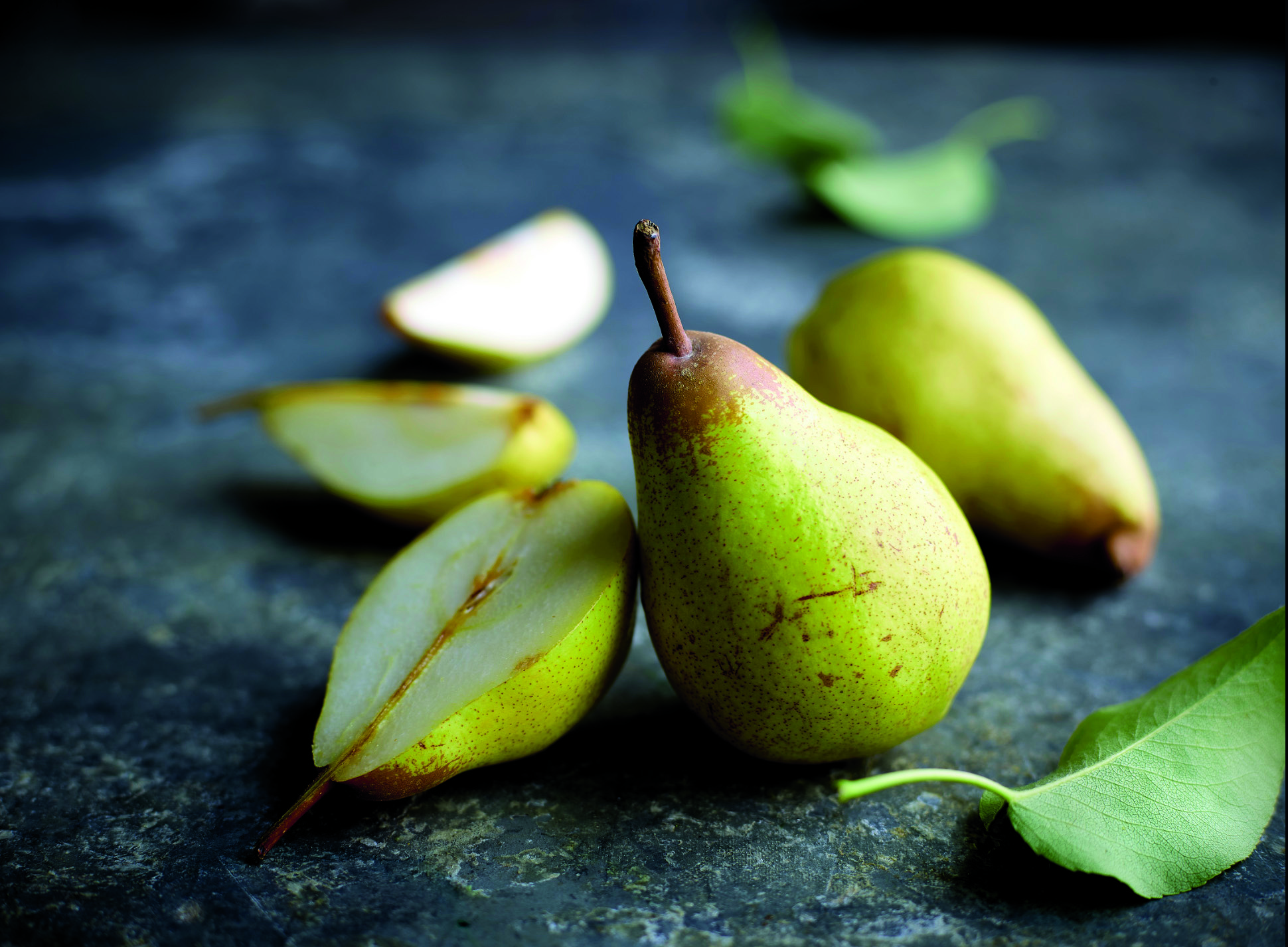 Pêra Rocha do Oeste are pears from spain and are similar to Bosc Pears. This image has pears cut to show delicious juiciness.