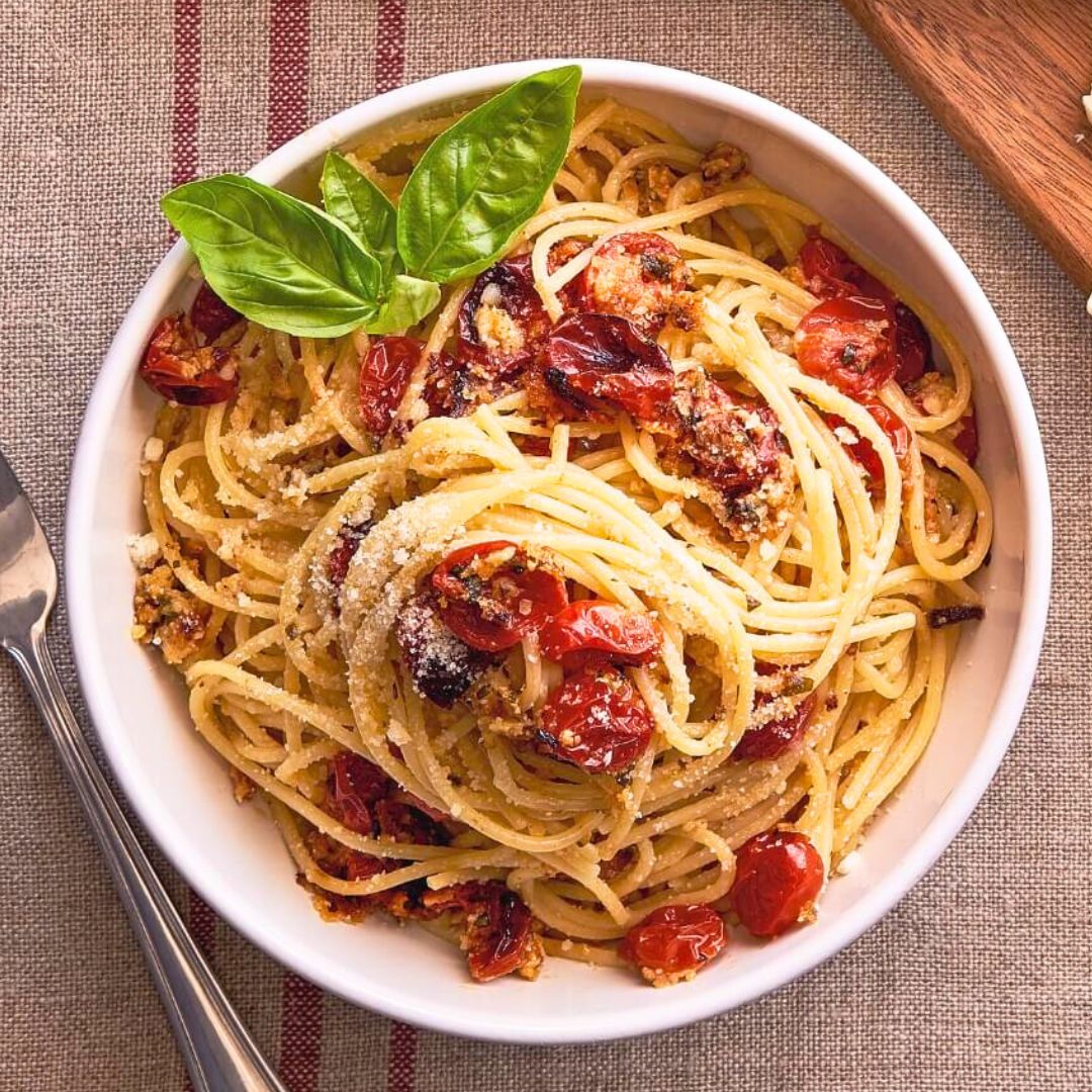 Bowl of roasted tomato pasta sauce and spaghetti