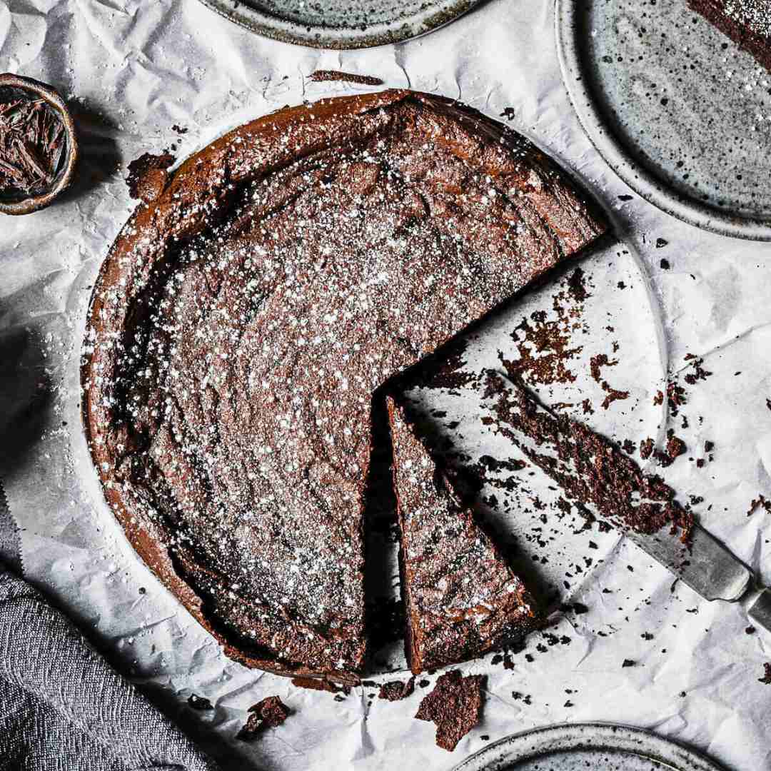 Torta Tenerina (Italian Chocolate Flourless Cake) sprinkled with powdered sugar