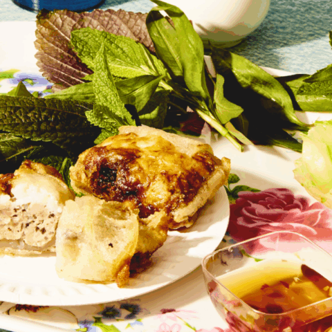 Vietnamese recipe for Crab and Pork Spring Rolls, served with salad and sauce