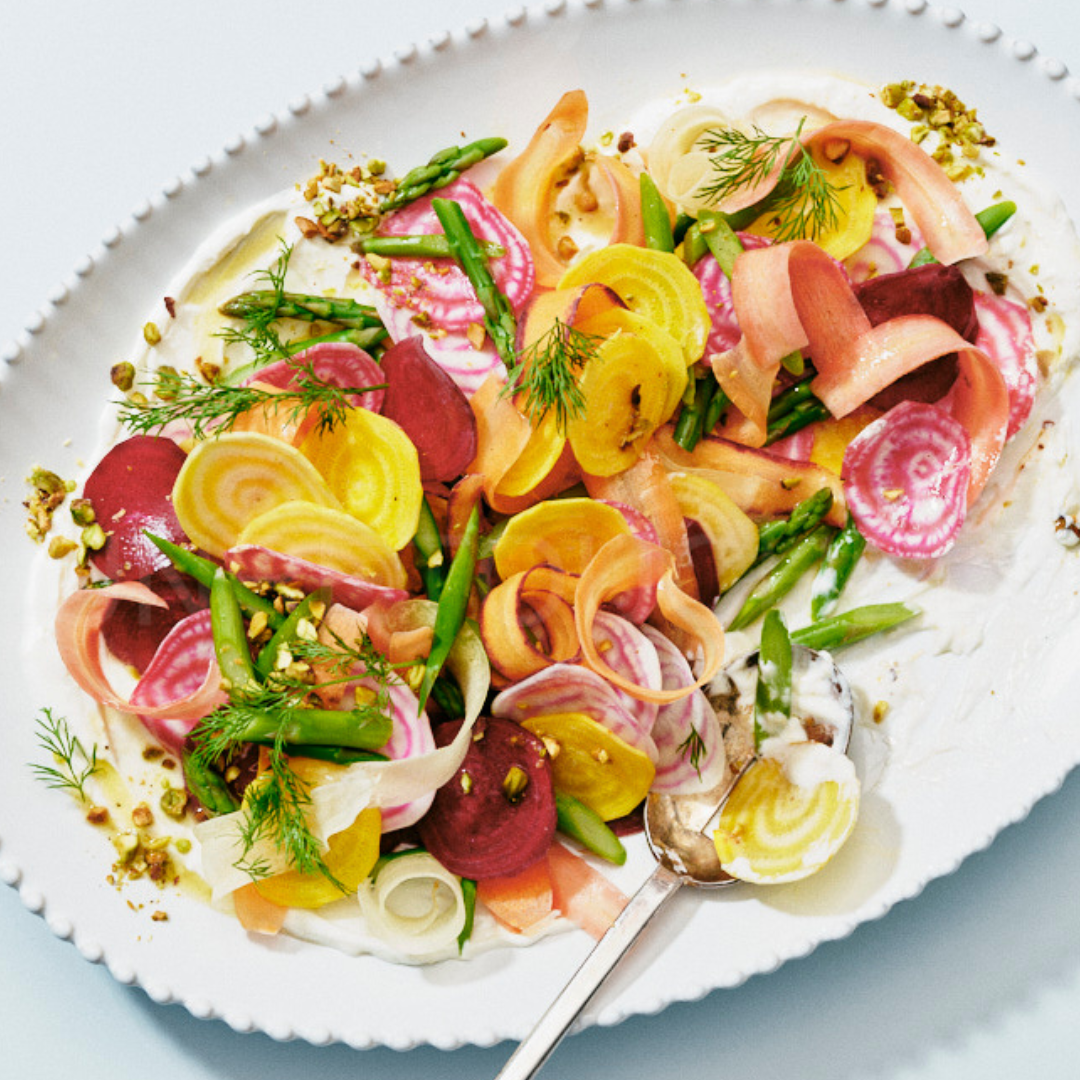Shaved carrot, asparagus and beet salad dressed with pistachios and creamy dressing
