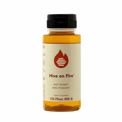 A bottle of Hive on Fire pure honey infused with chili peppers from Dript.