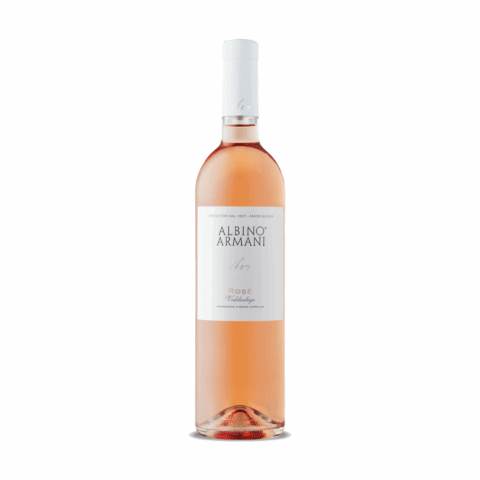A bottle of rose with a white label reading "Albino Armani."