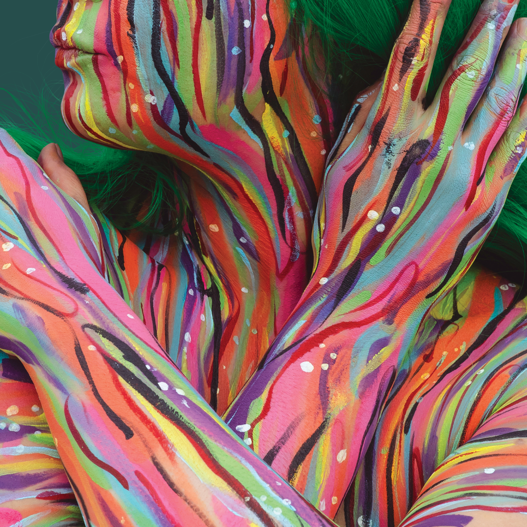 A close-up of a person's painted face and body.