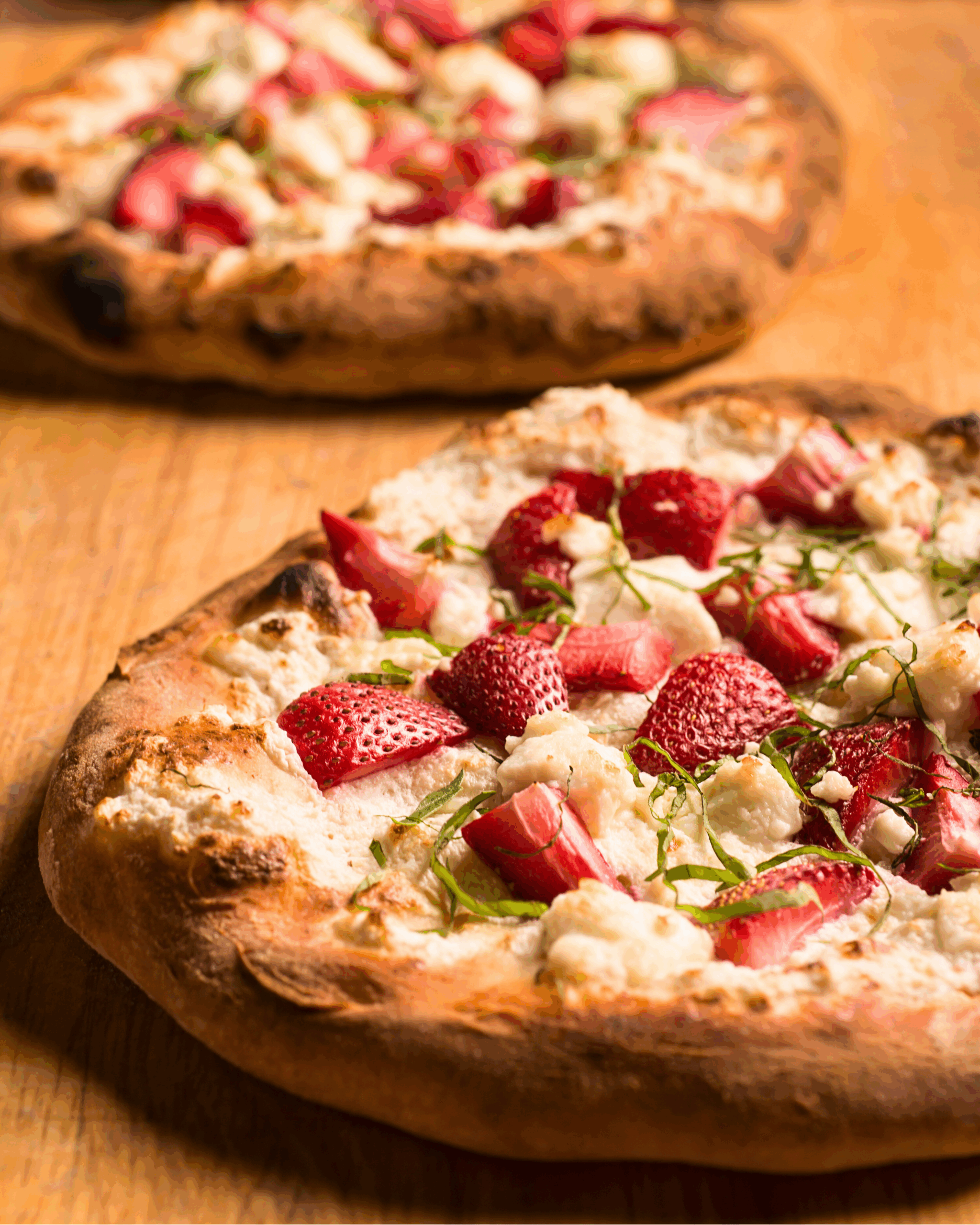 A strawberry goat cheese pizza hot right out of the oven.